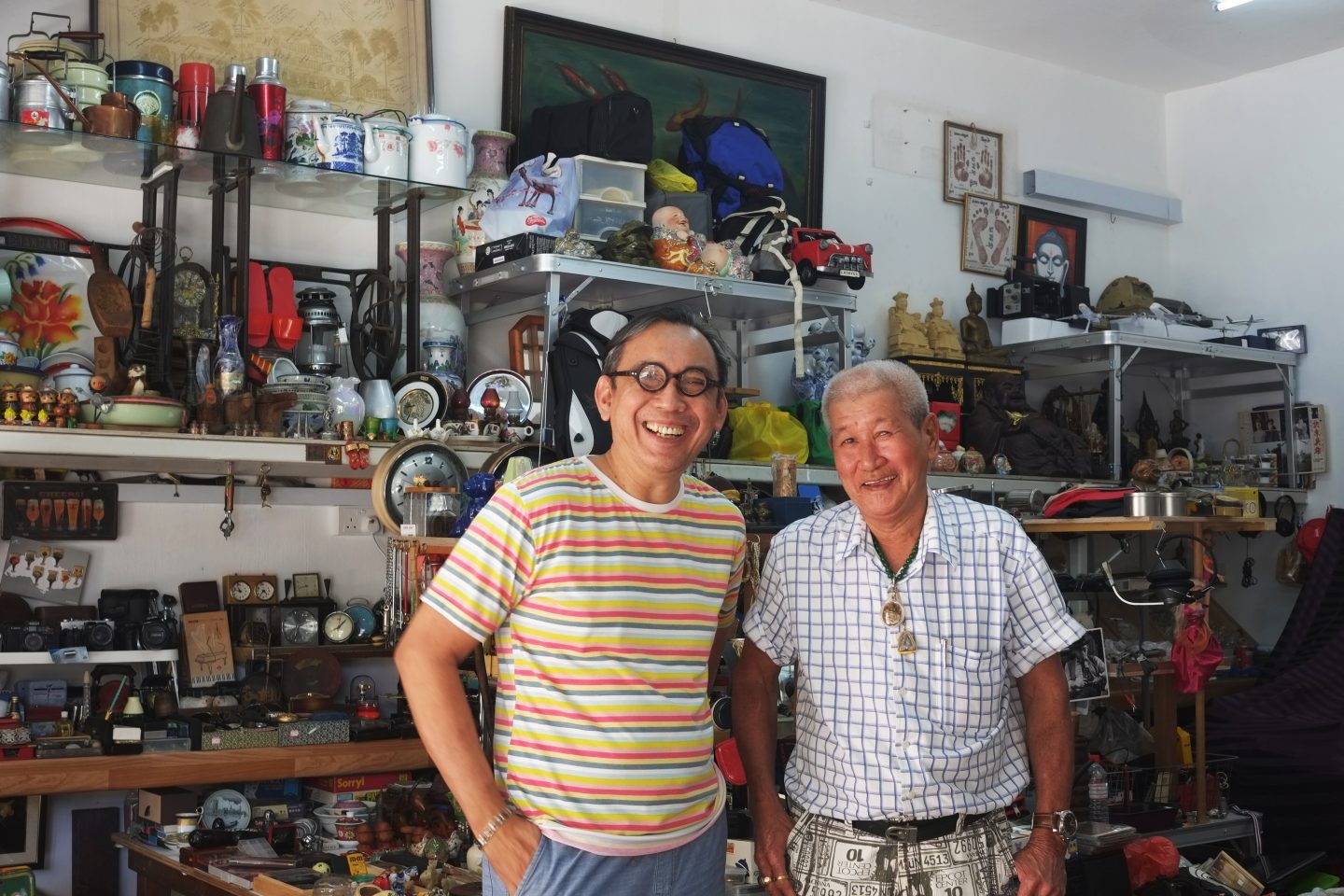 Former Sungei Road Market vendor Tang Khai Lam (right), 69, is just happy to have a place he can finally settle in, thanks to the founder of The Peranakan, Raymond Khoo (left). Photo by Gracia Lee.