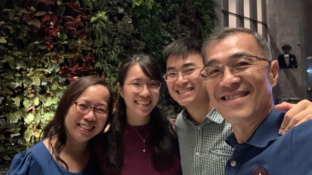Mona (left) and her husband Leong Weng Kwan (far right) taught the children to give from a young age. Today, their children Timothy and Terrynn are  generous givers. Photo courtesy of the Leong family.
