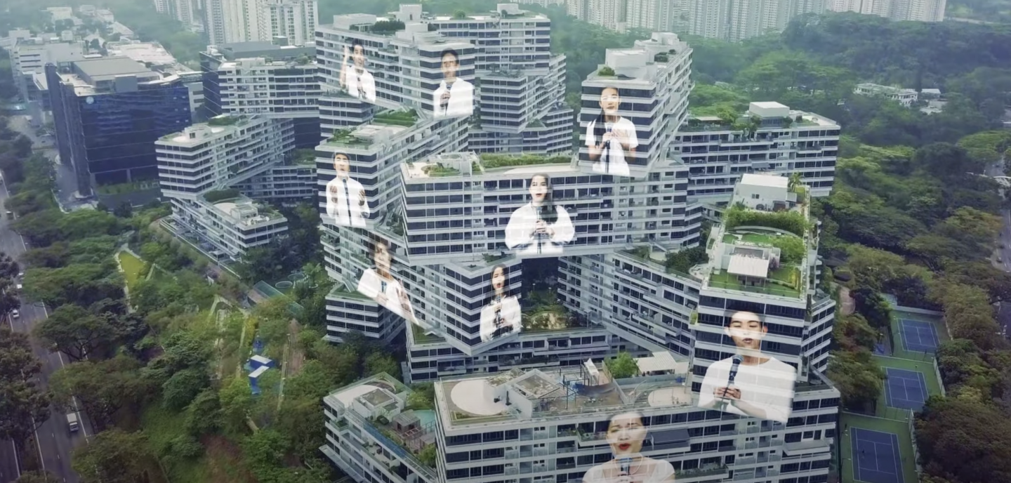 In the video, the singers are shown superimposed on various Singapore landmarks such as Marina Bay Sands, Gardens By The Bay and Clarke Quay in a hologram-like form. Screengrab of YouTube video.