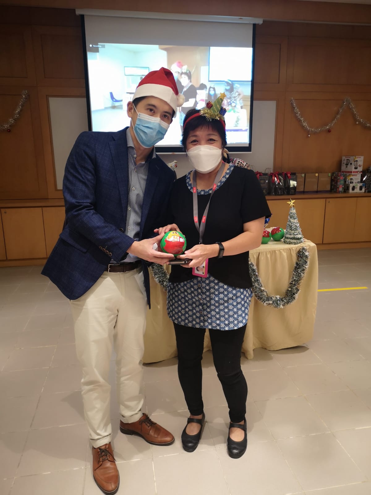 Koh with a staff member from Yeo's at the Christmas party. 