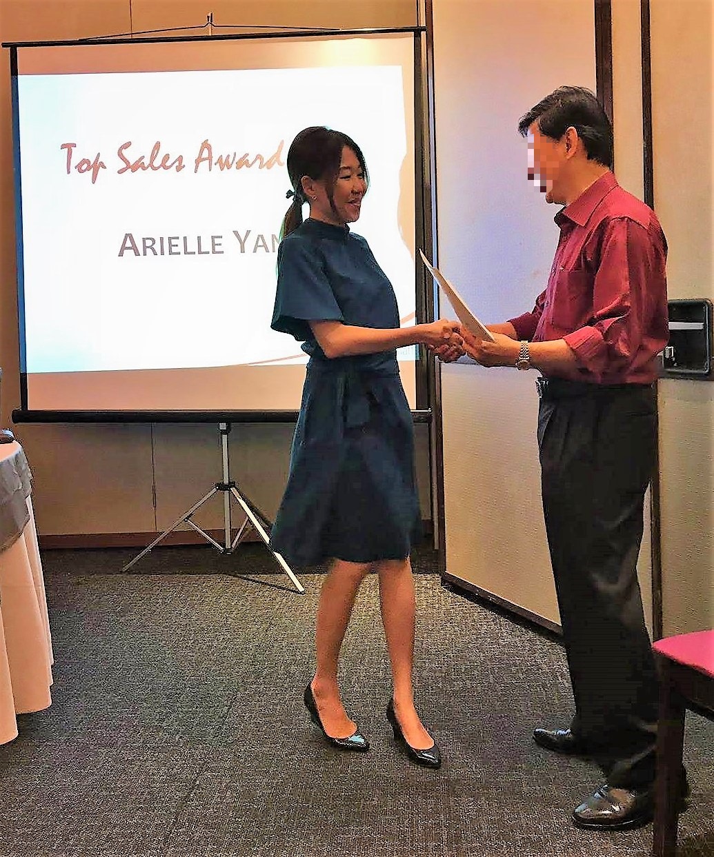 Arielle receiving an award at work. 