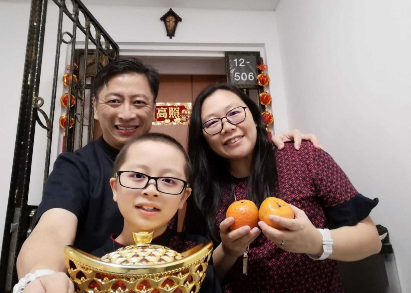Raphael and his parents celebrating Chinese New Year last year. 