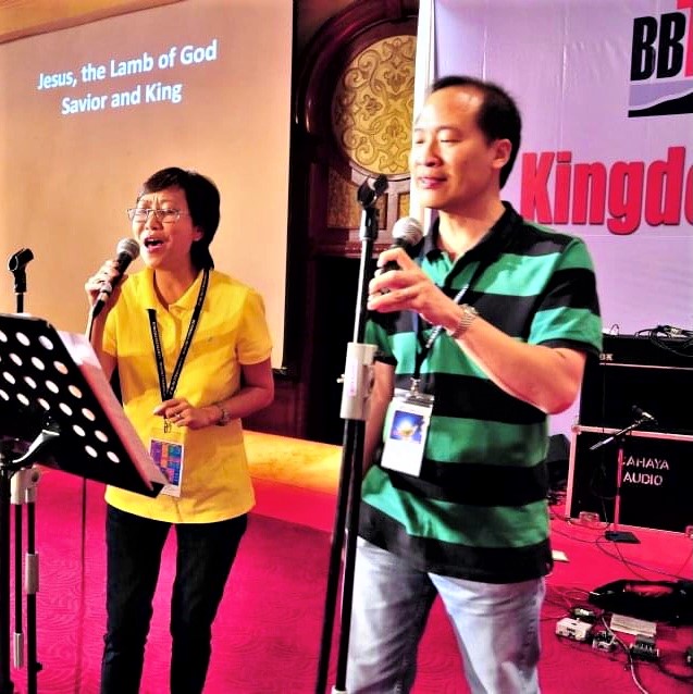 Lee and Chan serving in the worship team at a church camp in 2012. He later quit the ministry because certain songs triggered a strong reaction and he found it difficult to worship God.