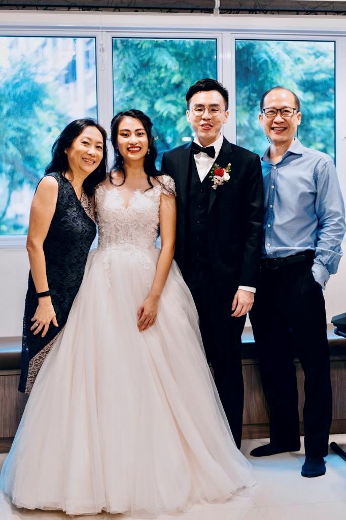 Lee and Chan with their god-daughter Jean and her husband Paul Yong on their wedding day. Journeying as a coujple through the depression has strengthened Lee and Chan's marriage.  