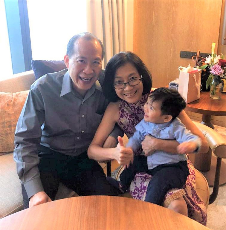 Chan  and Lee with their god-grandson Josh=Caleb Yap. The couple care for the toddler while his parents are at work.