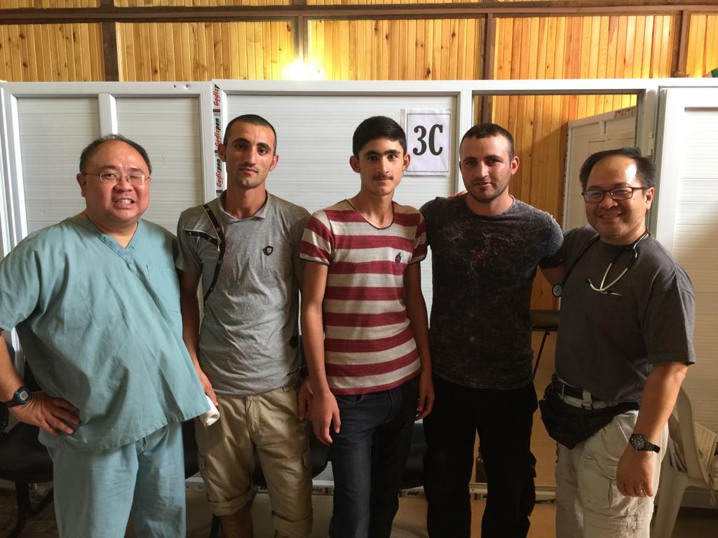 Willy (far left) and Dr David (far right) with their Yazidi interpreters in the camp. In 2020 the UNHCR estimated over 11.7 million Internally Displaced Persons (IDPs) and more than 2.7 million refugees in the Middle East. 