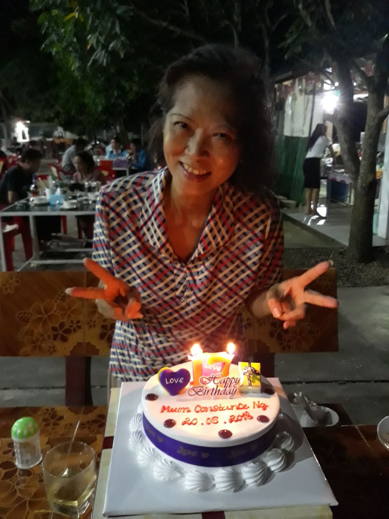 Constance celebrating her 71st birthday in Cambodia. Her fellow teachers cheekily reversed the candles to 17 instead of 71. 