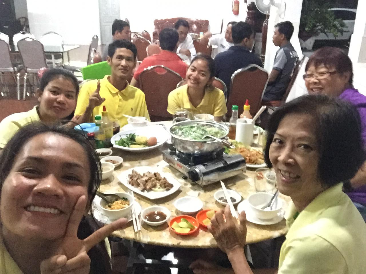 Constance having a team dinner with her fellow teachers and a Singaporean volunteer at a restaurant in Svay Rieng town.