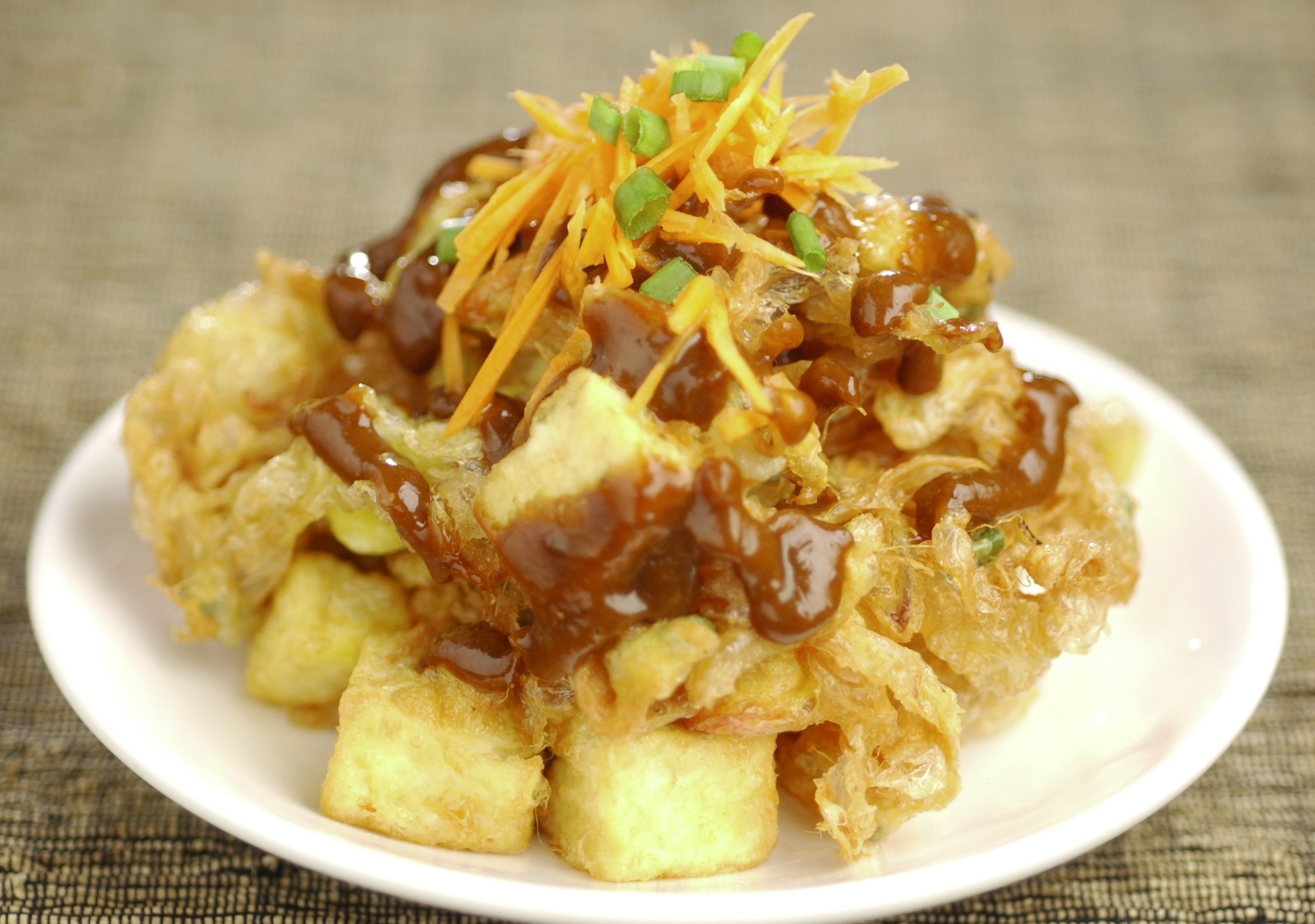 Tahu telor (fried beancurd with eggs) is one of The Rice Table's signature dishes. Sih co-created the menu with his head chef and can cook every dish offered in the restaurant.