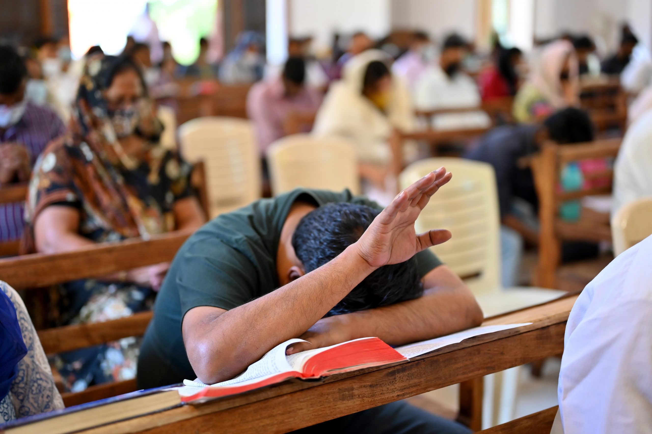 Worshippers praying on Good Friday at Epiphany Church in Gurgaon, India. Photo by Sudarshan Jha/ Shutterstock.com. 02 April 2021.