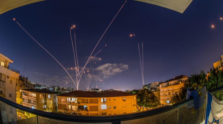 Iron dome rocket interceptions of Hamas rockets night attack in May 2021. Photo by Oren Ravid on Shutterstock.