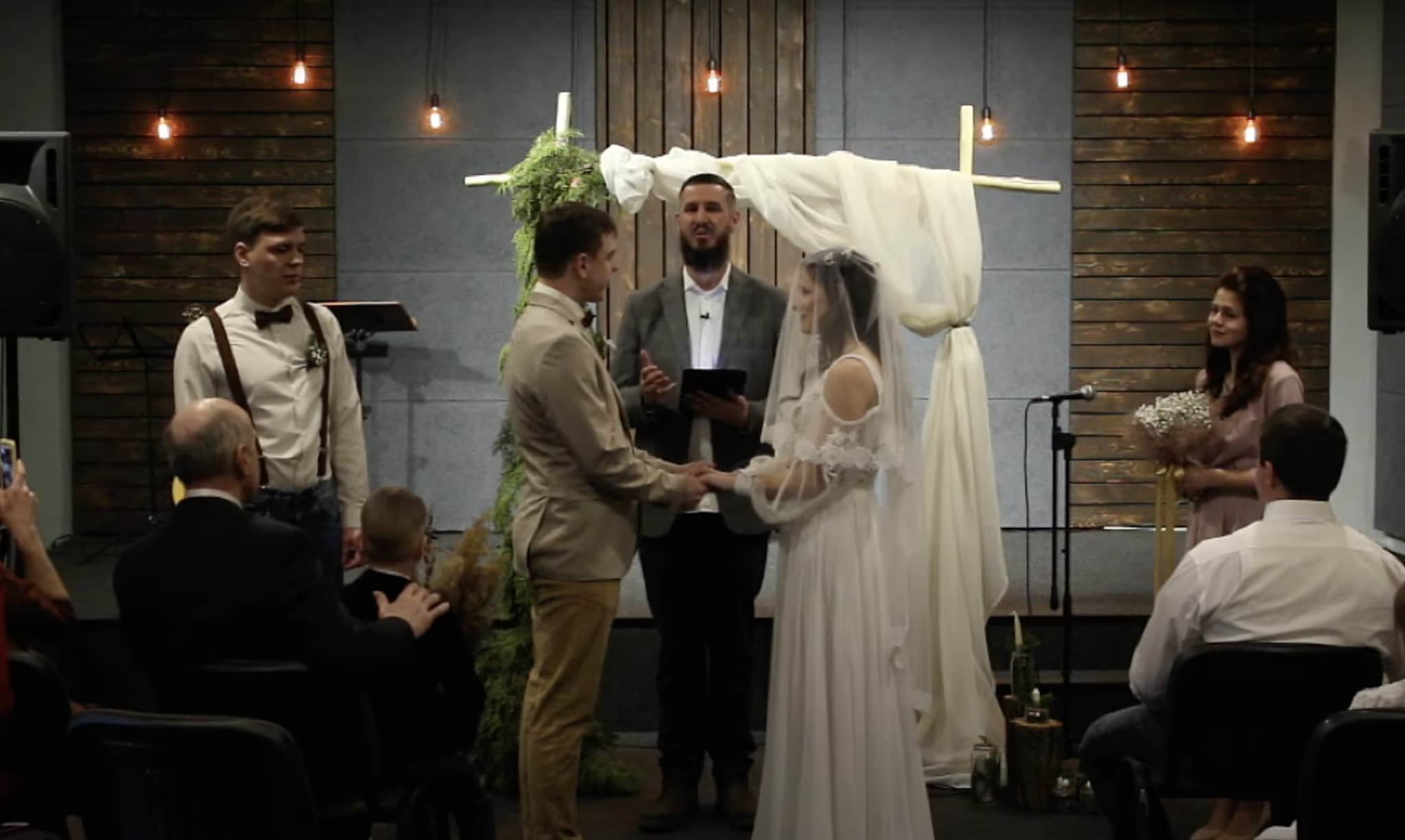 Pastor Benjamin Morrison solemnising the wedding of Andrey and Nadya on the third day of the war in Ukraine. what better reminder that even war cannot stamp out love?