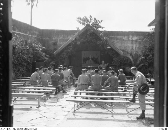 Prisoners of war attending a church service in a small chapel in Changi Gaol. Photo courtesy of the Australian War Memorial (117658).