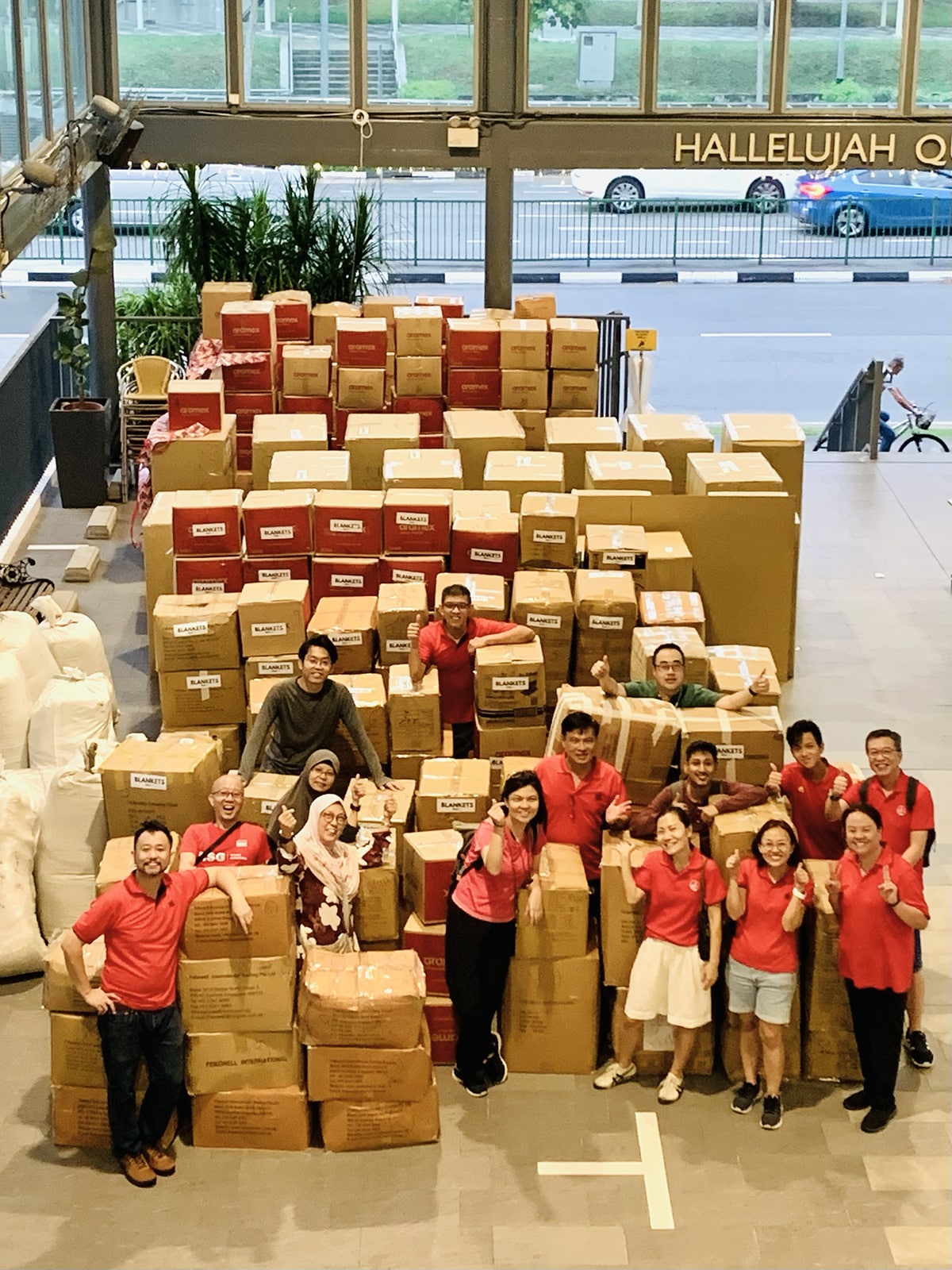 Members of Relief Singapore, Bethesda Bedok Tampines Church, and volunteers at the Gaza blankets donation drive with the almost 2,500 blankets collected on Nov 11-12.