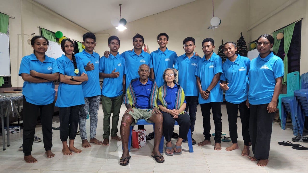 Joseph Mannar and Grace Kellan (first row), pictured here with local Timorese students, up and left their comfortable life in Singapore to run a student hostel in Timor-Leste more than a decade ago. All photos courtesy of Joseph Mannar.