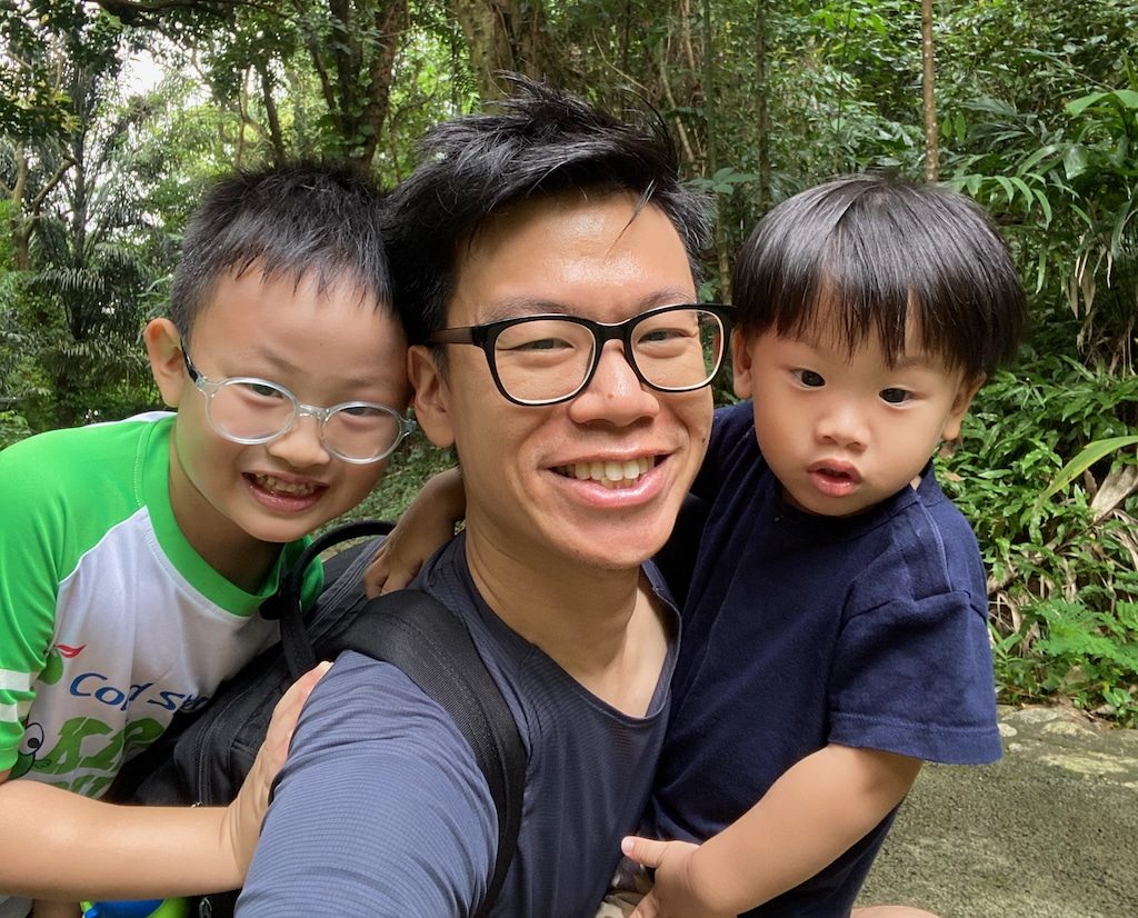 Josiah Ng and his two sons outdoors